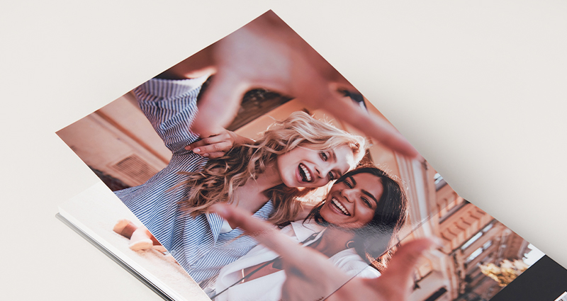 Family photo placed in a professional layflat photo book for a portfolio.
